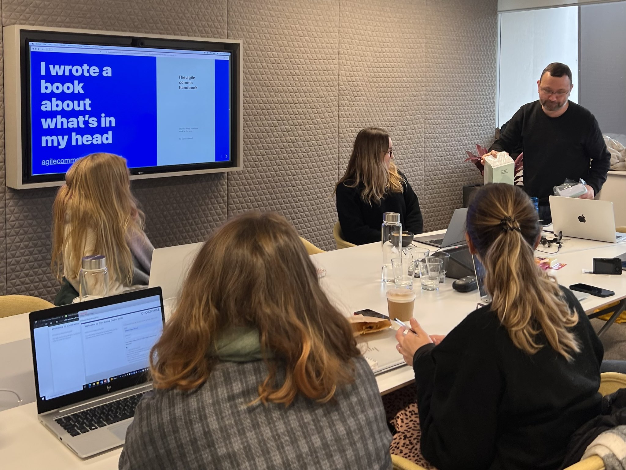 A photo of Giles Turnbull talking to the team about working in the open