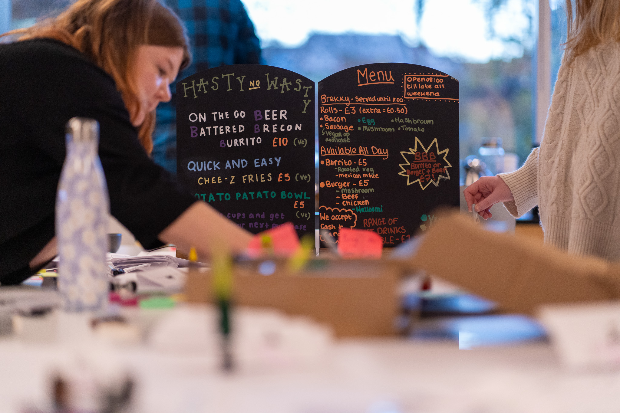 A photo of the menus designed by each of the teams in the session 2 design challenge
